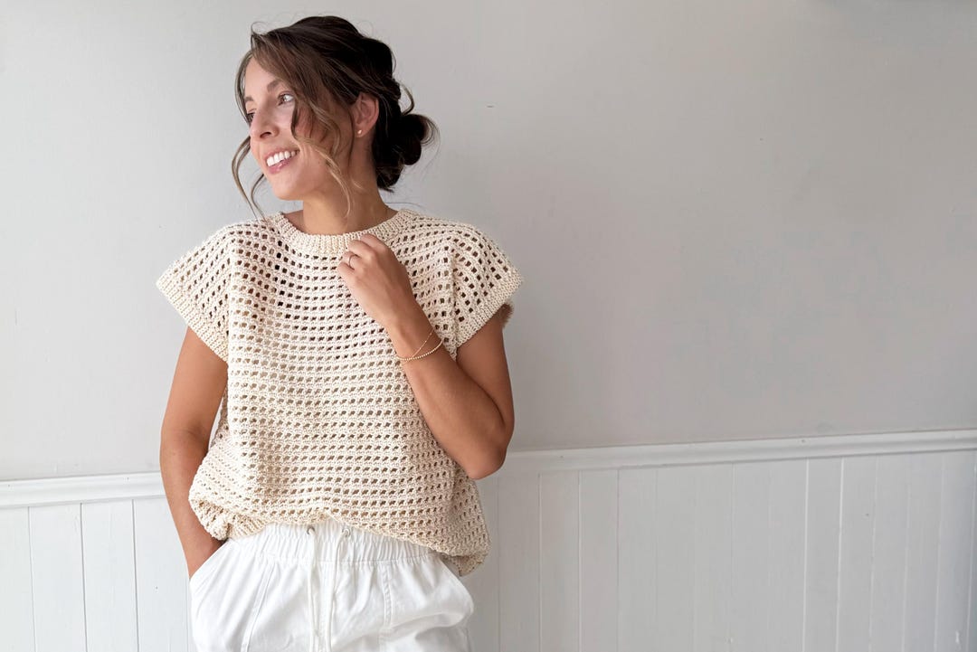 Cream open-weave rattan-style crochet top with short sleeves