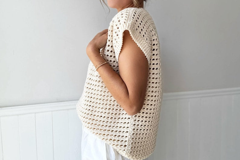 Loose-fit cream crochet top with airy weave