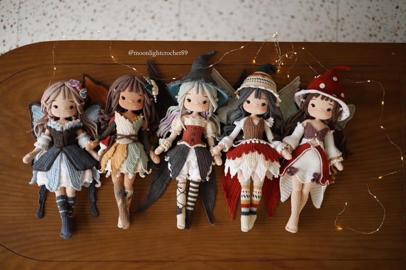 Five handmade crochet fairy dolls with detailed outfits and wings
